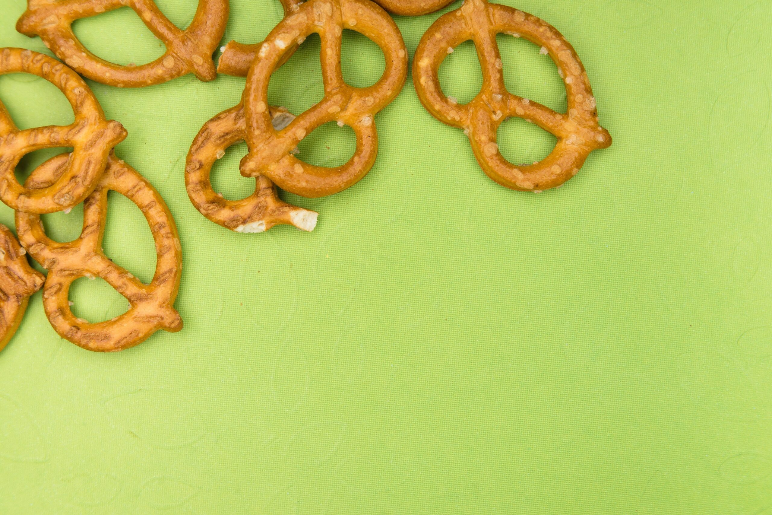 A gamer enjoying gluten-free pretzels at their setup