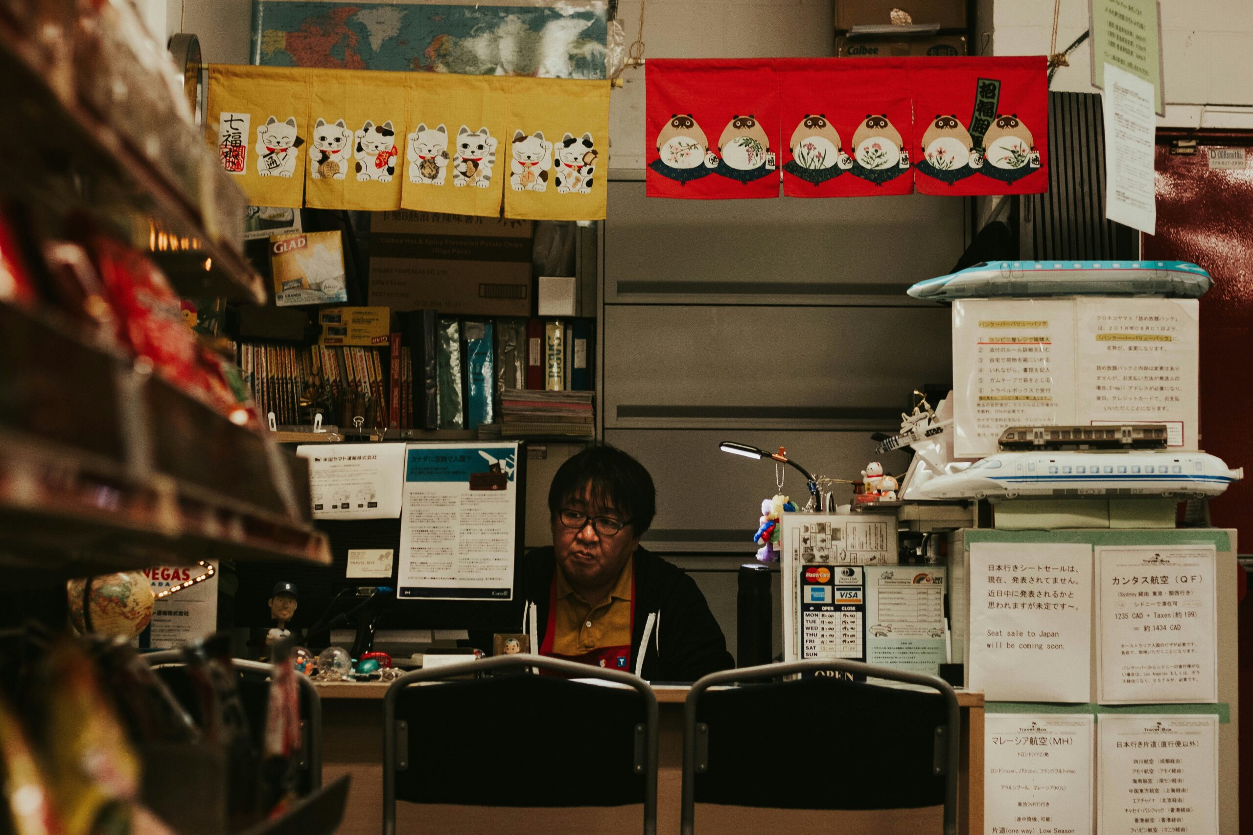 A gamer sitting at their desk surrounded by homemade snacks like popcorn, cookies, and chips.