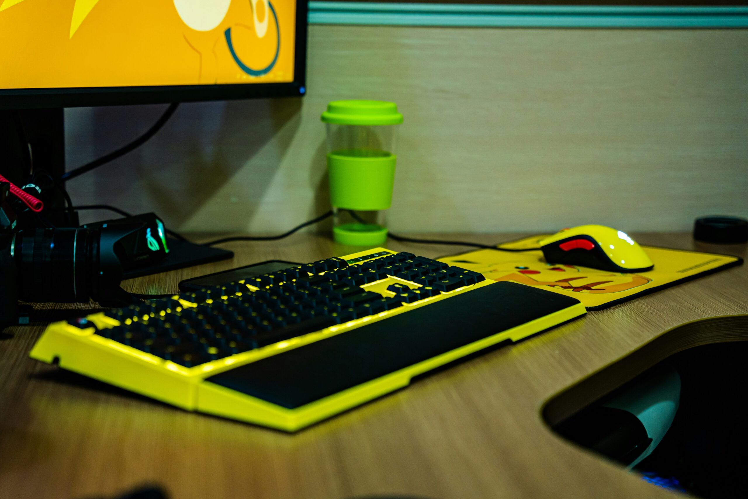 A professional gamer's setup featuring a balanced plate of healthy snacks next to their gaming gear