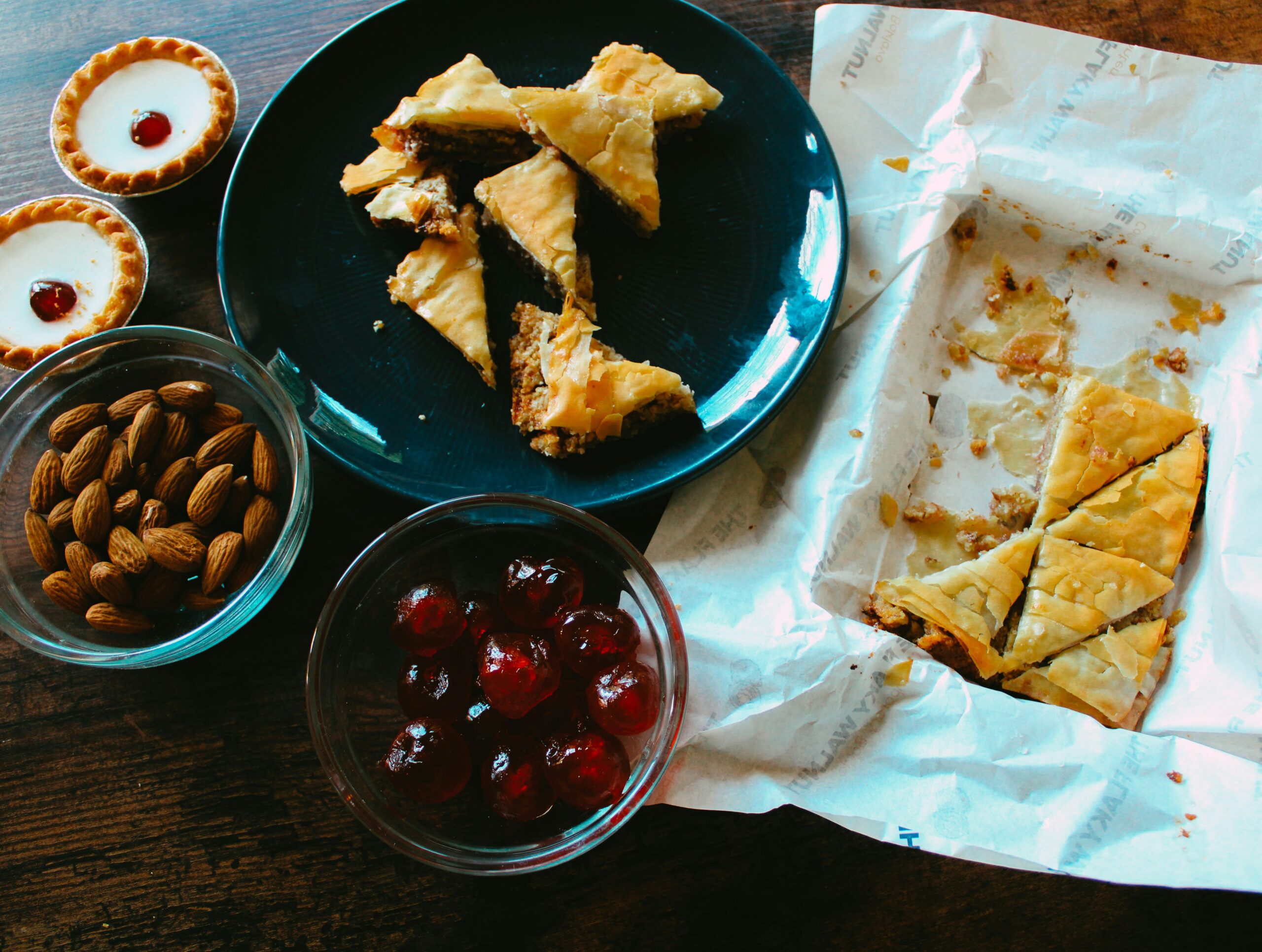A split screen image comparing two gamers' snack spreads: one featuring dried fruit mixes and another showcasing homemade granola bars.