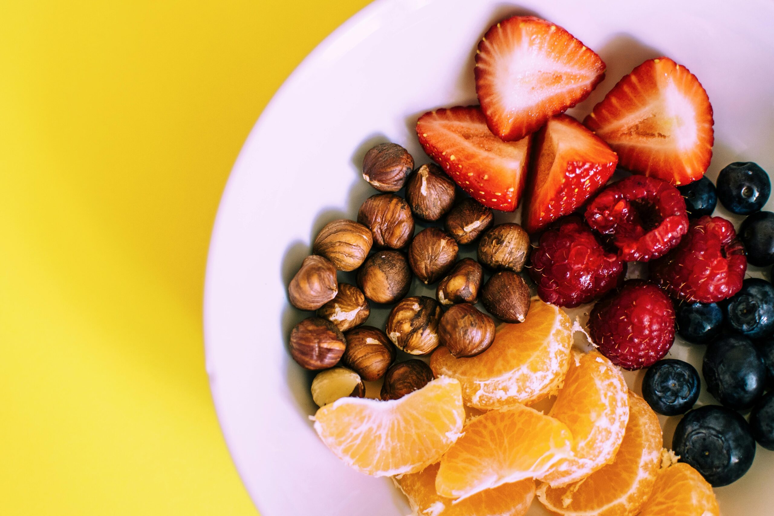 A table setup with bananas, nuts, and coconut water for gamers