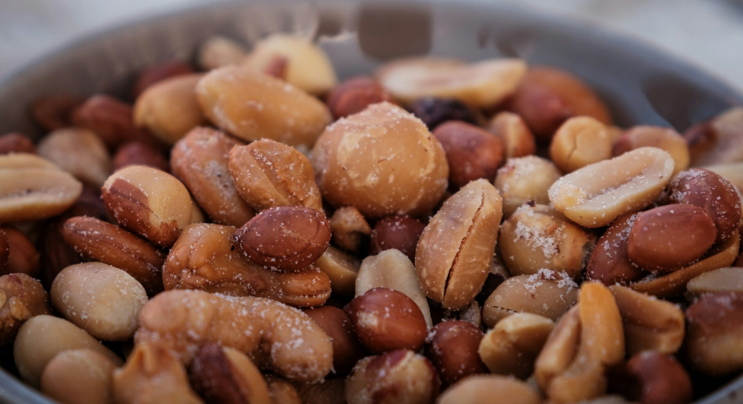 A tray of fresh fruits and nuts as healthy alternatives to processed snacks