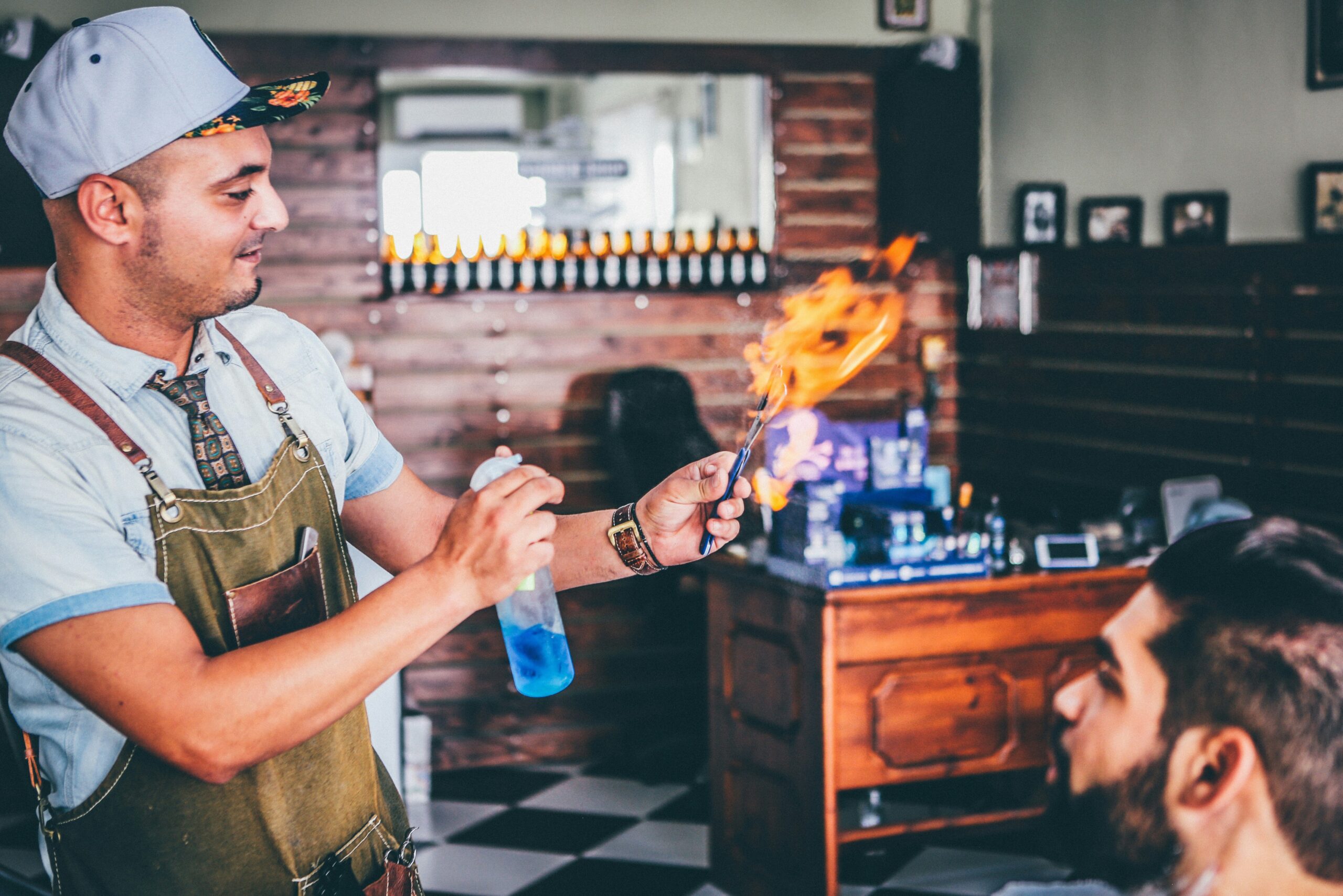 Esports player holding both a hydration bottle and snack bar.