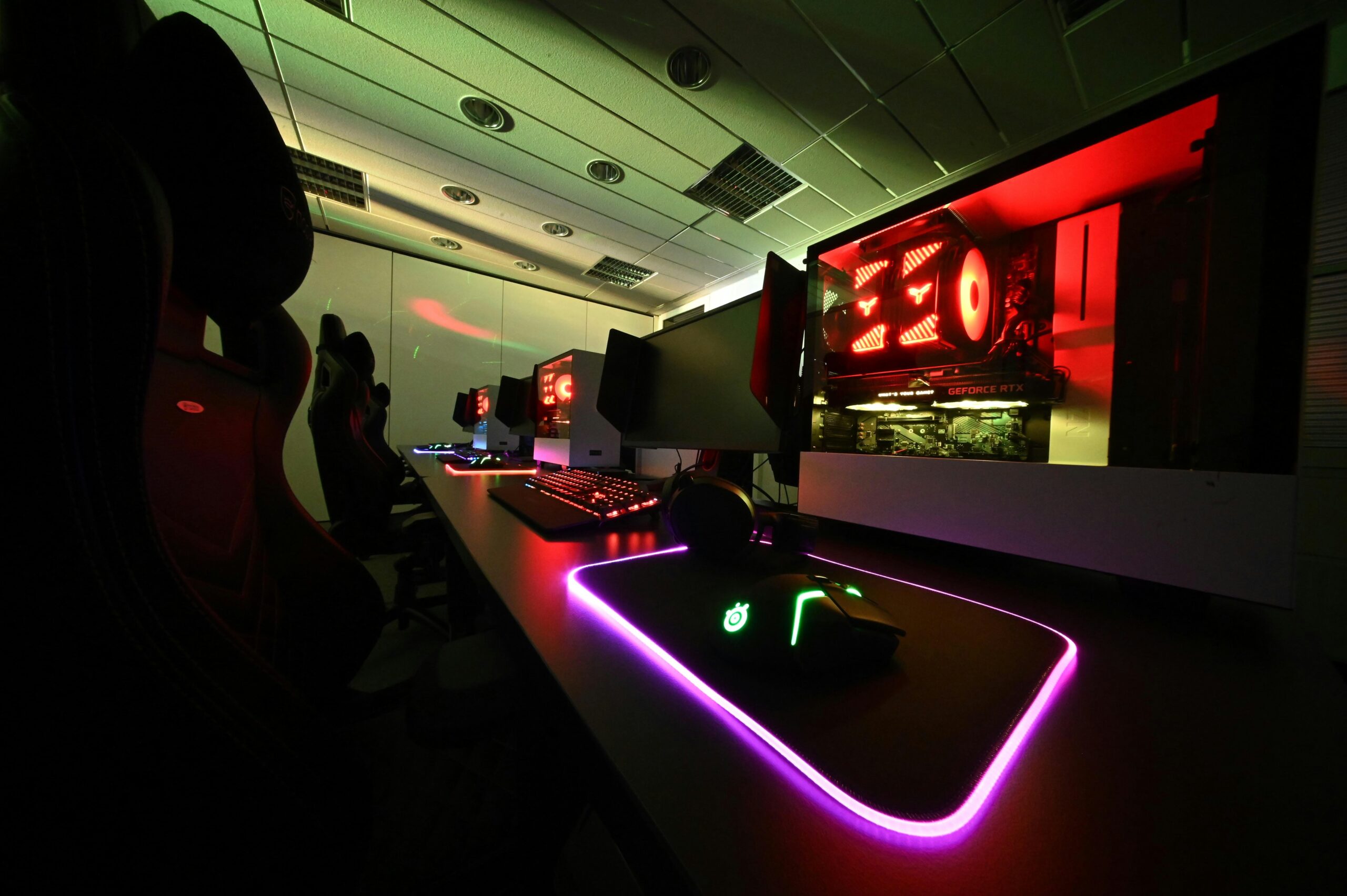 A clean gaming desk setup with snacks within arm's reach.