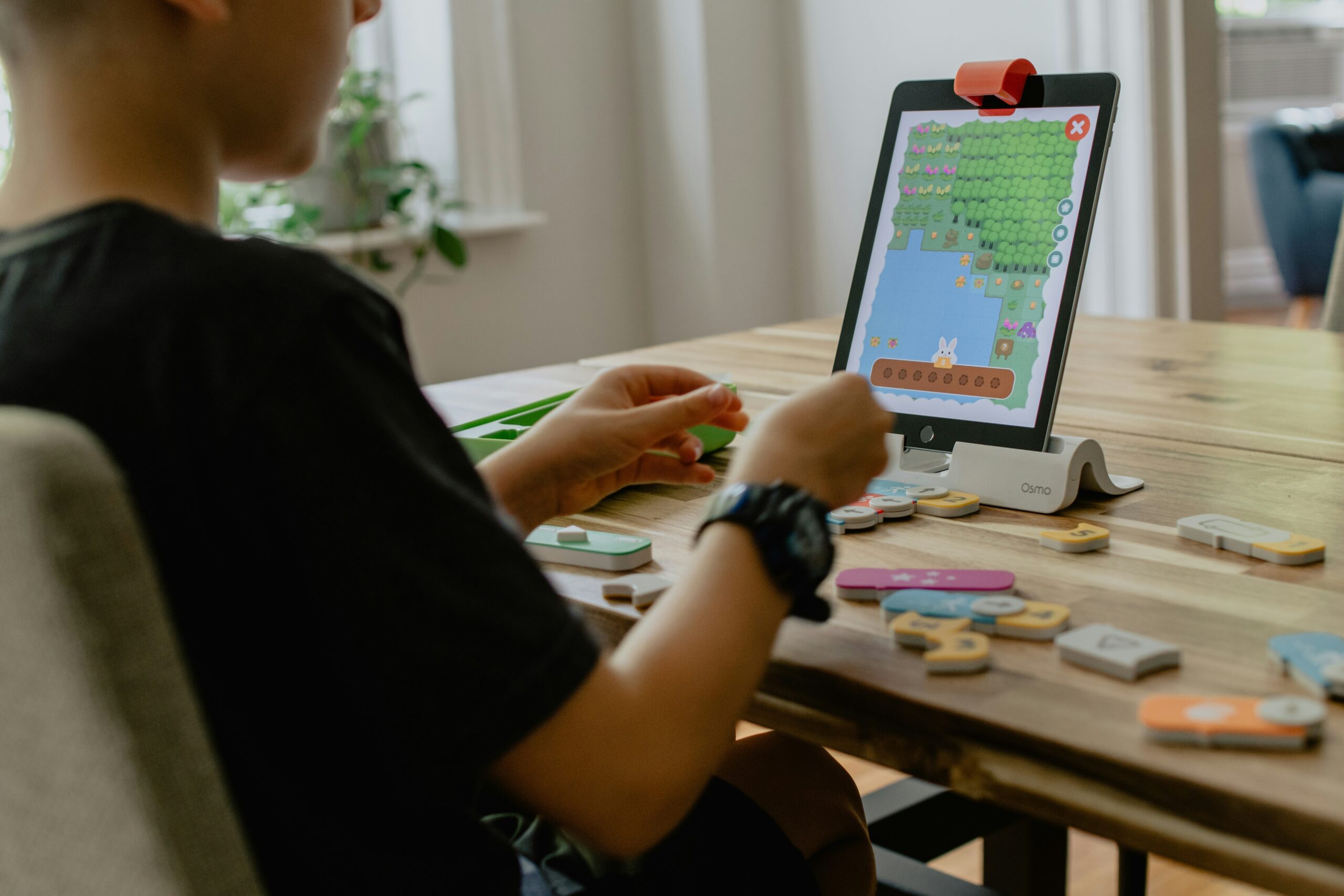 A gamer enjoying a healthy snack at their desk