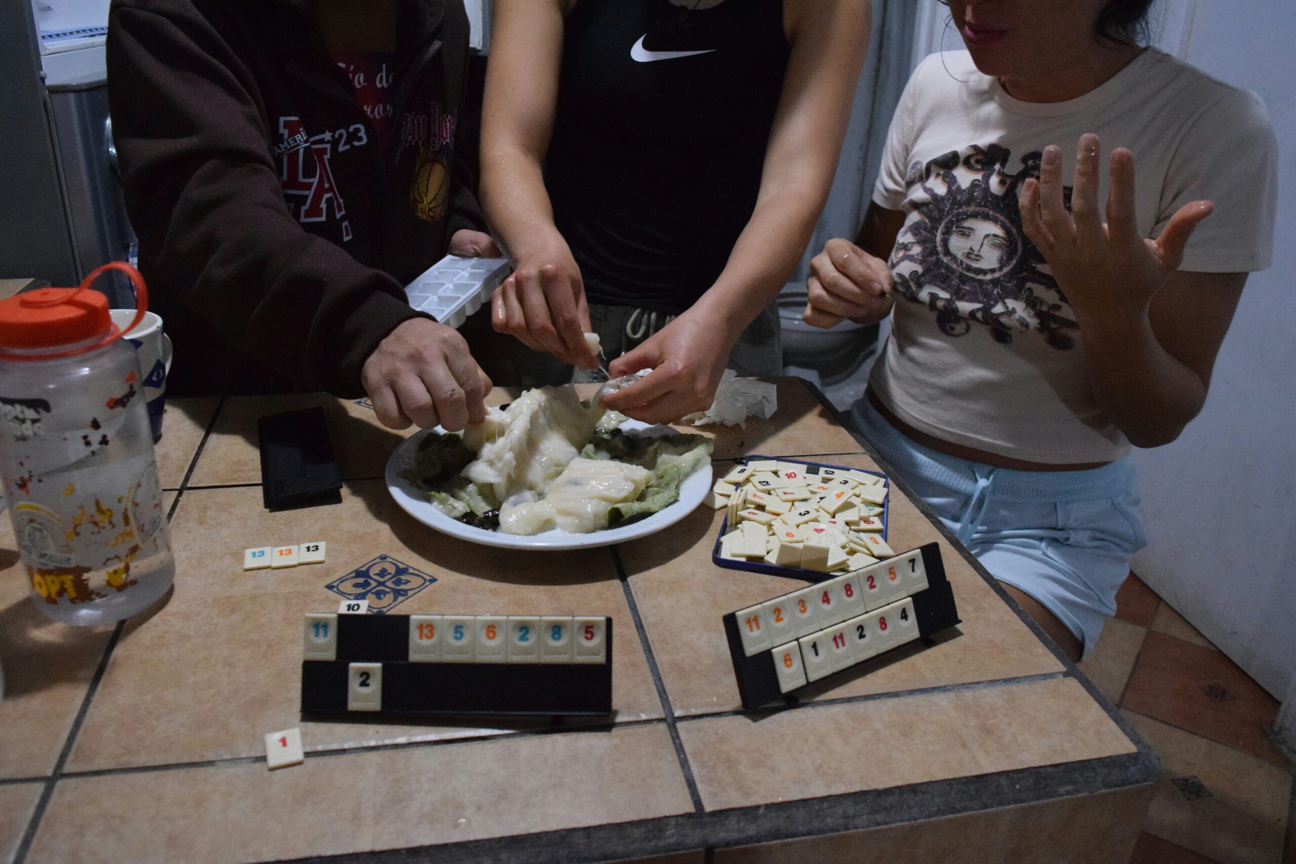A gamer struggling with empty chip bags during an intense battle scene.