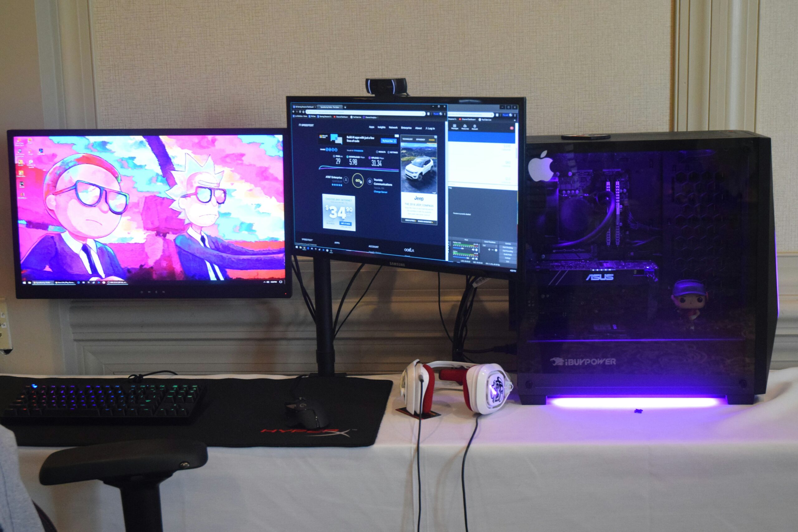 A professional gamer streaming live with snacks neatly arranged beside their rig.
